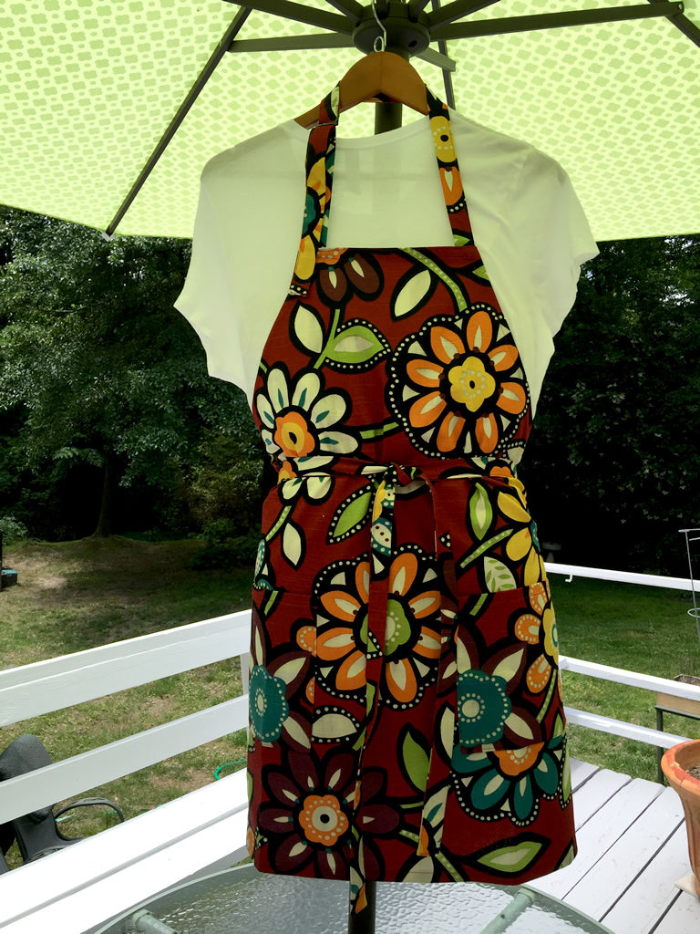 Chef's apron featuring bold colorful flowers.