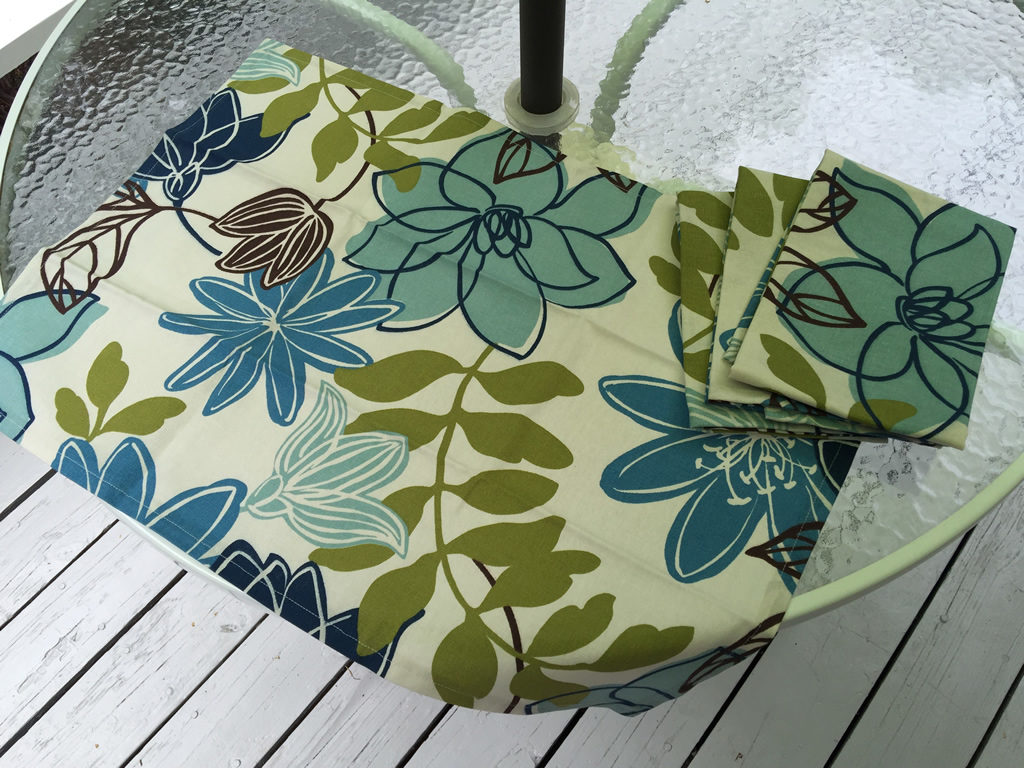 Decorative towel featuring blue flowers and green leaves. (TWL-012)