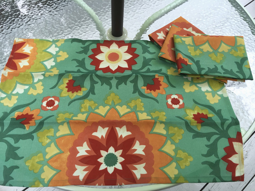 Decorative towel featuring bold flowers on a teal green background (TWL-006)